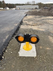 Flashing yellow LED runway guard lights at taxiway intersection Cottbus Airport